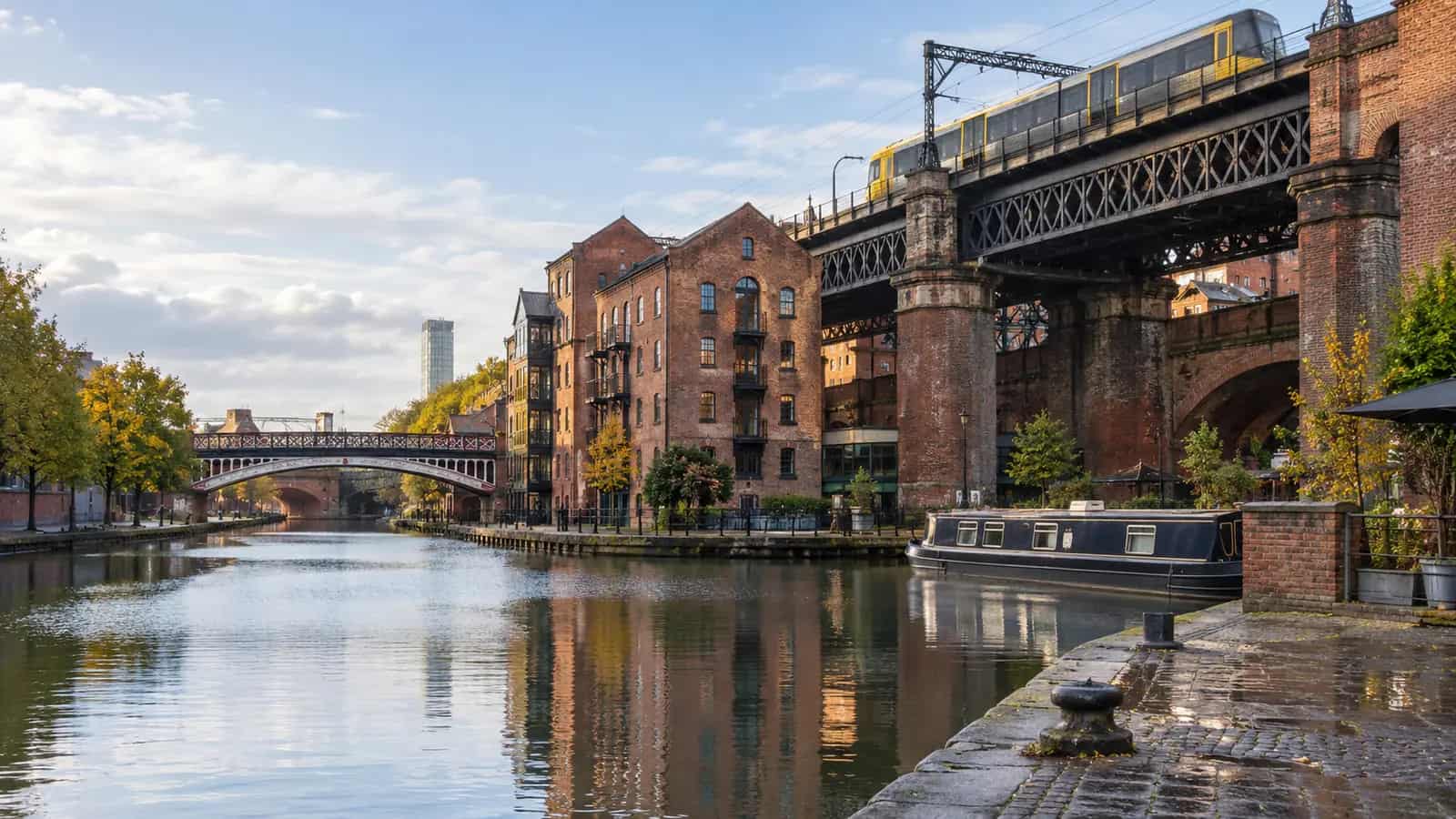 Castlefield canal, red-brick warehouses and railway viaducts in Manchester