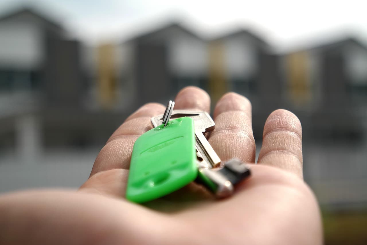 Family holding the keys to their new shared ownership home
